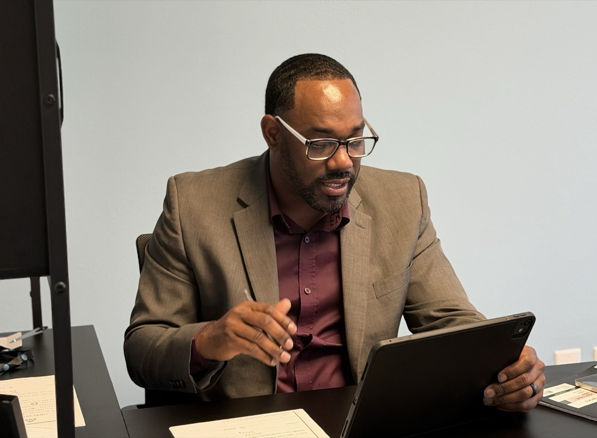 Ireti Marketing professional consultant engaging clients face-to-face in Houston