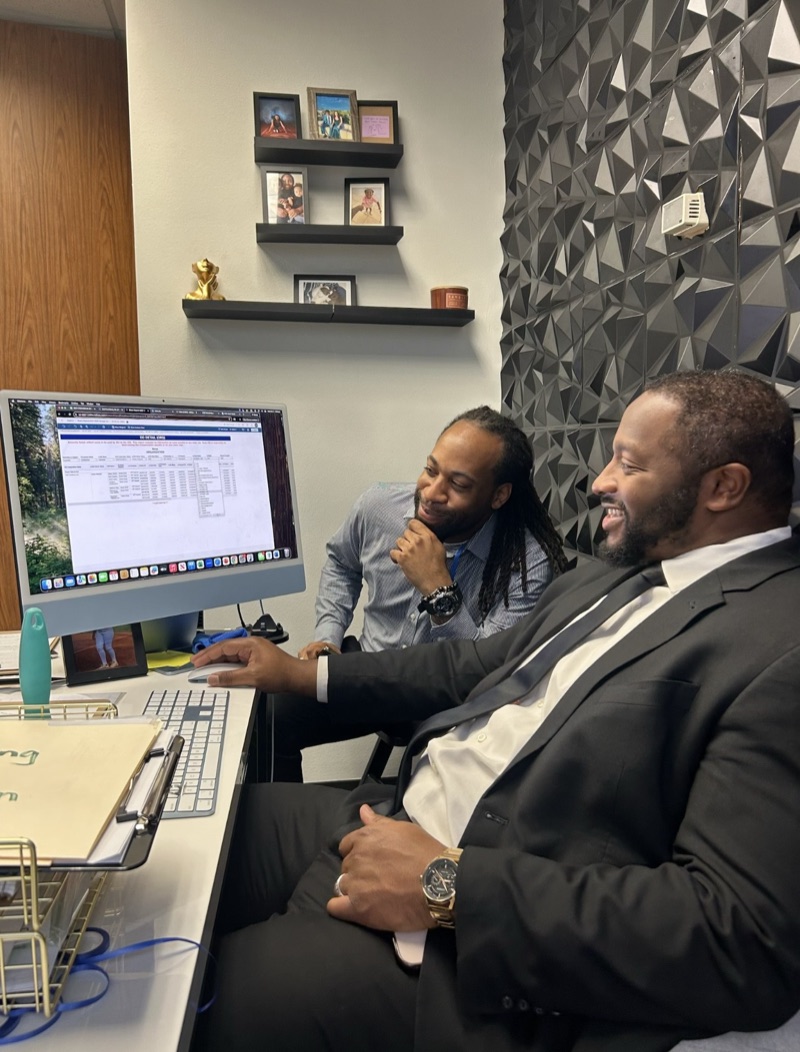 Ireti Marketing consultants reviewing strategy and results with clients